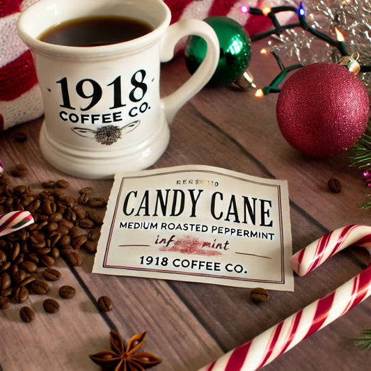 Image of Candy Cane Flavored Coffee from 1918 Coffee Co., featuring candy canes, coffee beans, and a steaming cup of coffee.